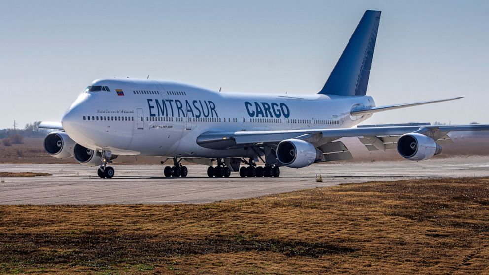 A Venezuelan-owned Boeing 747 taxis on the runway after landing in the Ambrosio Taravella airport in Cordoba, Argentina, Monday, June 6, 2022. Argentine officials are trying to determine what to do with the cargo plane loaded with automotive parts an