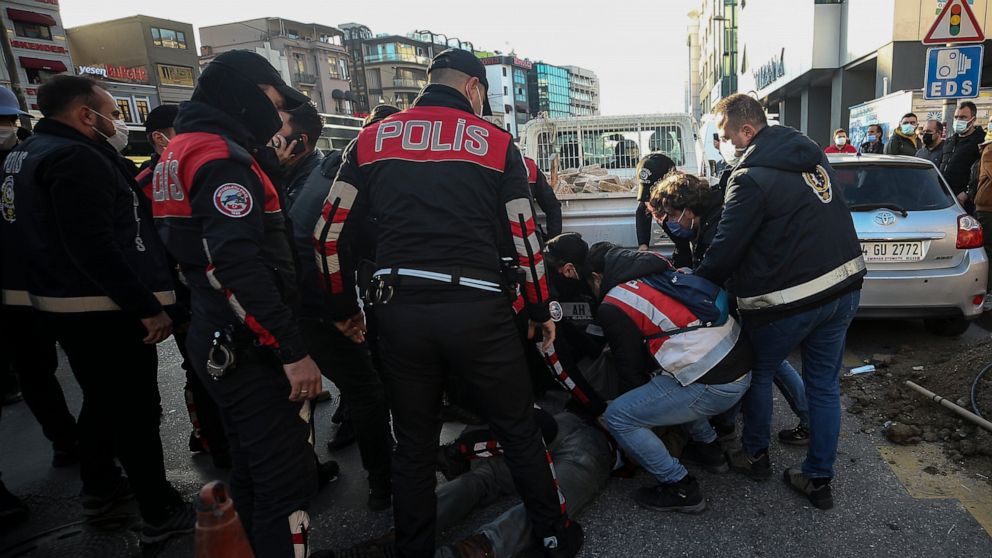 Police officers detain supporters of Bogazici University students following a protest in Istanbul, Thursday, Feb. 4, 2021. For weeks, students and faculty members of Bogazici University have been protesting Turkey's President Recep Tayyip Erdogan's J