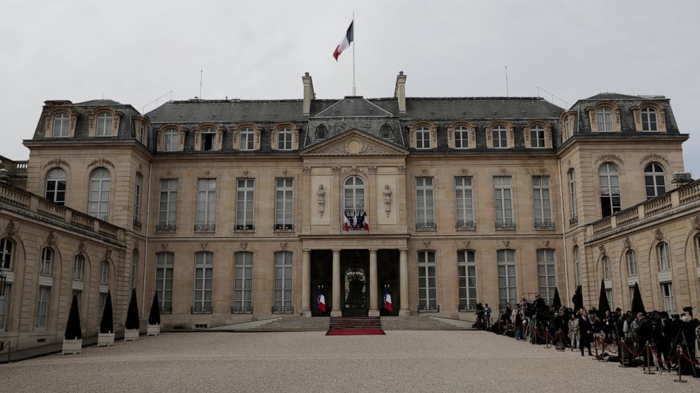 Journalists wait in the courtyard of the Elysee Palace prior to the inauguration ceremony of French President Emmanuel Macron, in Paris, France, Saturday, May 7, 2022. Macron was reelected for five years on April 24 in an election runoff that saw him