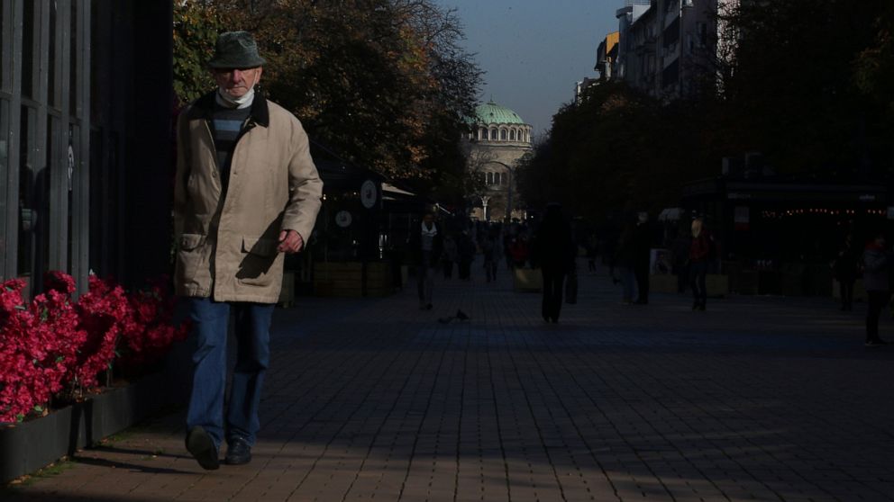 Bulgarians vote in third election round as infections surge