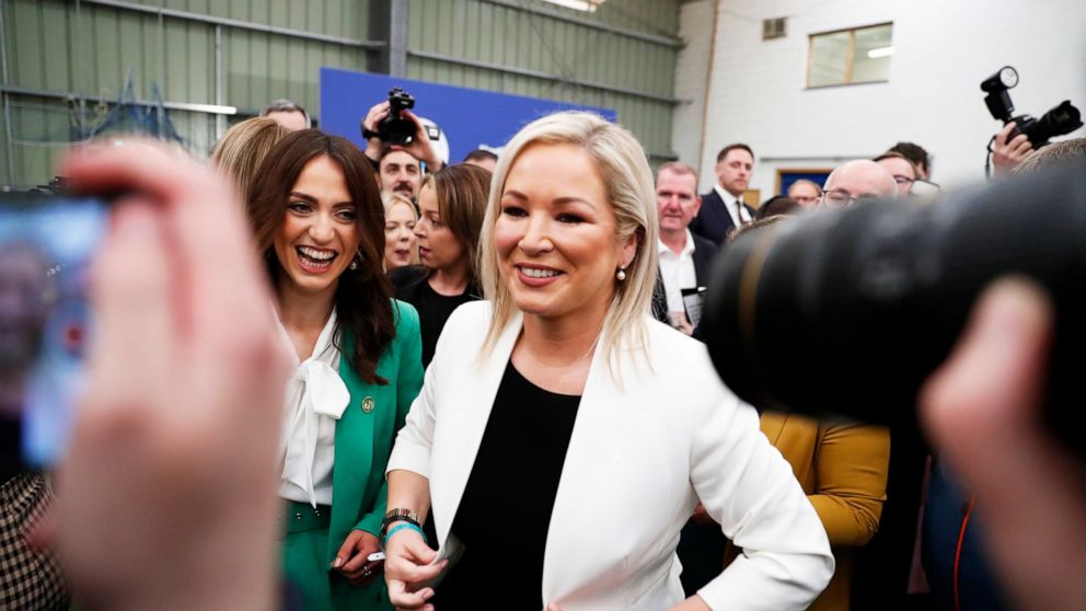Sinn Fein's Vice President Michelle O'Neill, centre, welebrates with party colleagues after being elected in Mid Ulster at the Medow Bank election count centre in Magherafelt , Northern Ireland, Friday, May, 6, 2022. (AP Photo/Peter Morrison)