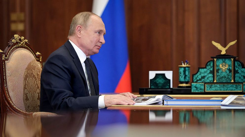 Russian President Vladimir Putin attends a meeting the Kremlin in Moscow, Russia, Monday, Nov. 29, 2021. (Evgeny Paulin, Sputnik, Kremlin Pool Photo via AP)