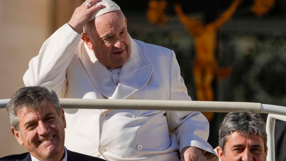 Pope Francis leaves at the end of his weekly general audience in St. Peter's Square at The Vatican, Wednesday, Nov. 30, 2022. (AP Photo/Andrew Medichini)