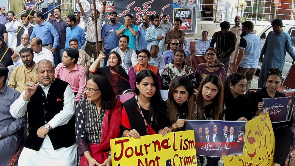 Journalists and employees of a private news channel ARY hold a protest against their channel being taken off-air by the Pakistan media regulator authority, in Islamabad, Pakistan, Friday, Aug. 12, 2022. Pakistani authorities on Friday revoked a broad