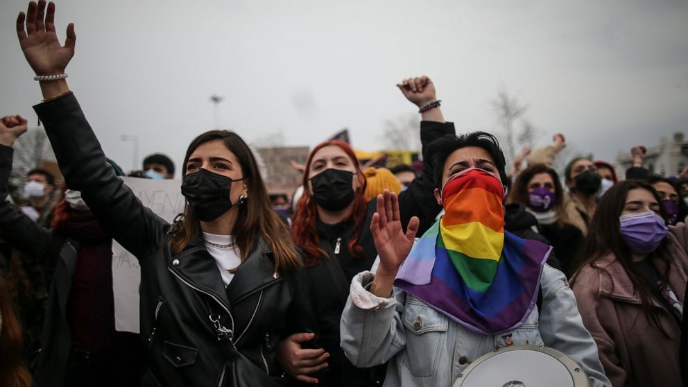 Protesters chat slogans during a rally in Istanbul, Saturday, March 2021, 2021. Turkey's President Recep Tayyip Erdogan's overnight decree annulling Turkey's ratification of the Istanbul Convention is a blow to women's rights advocates, who say the a