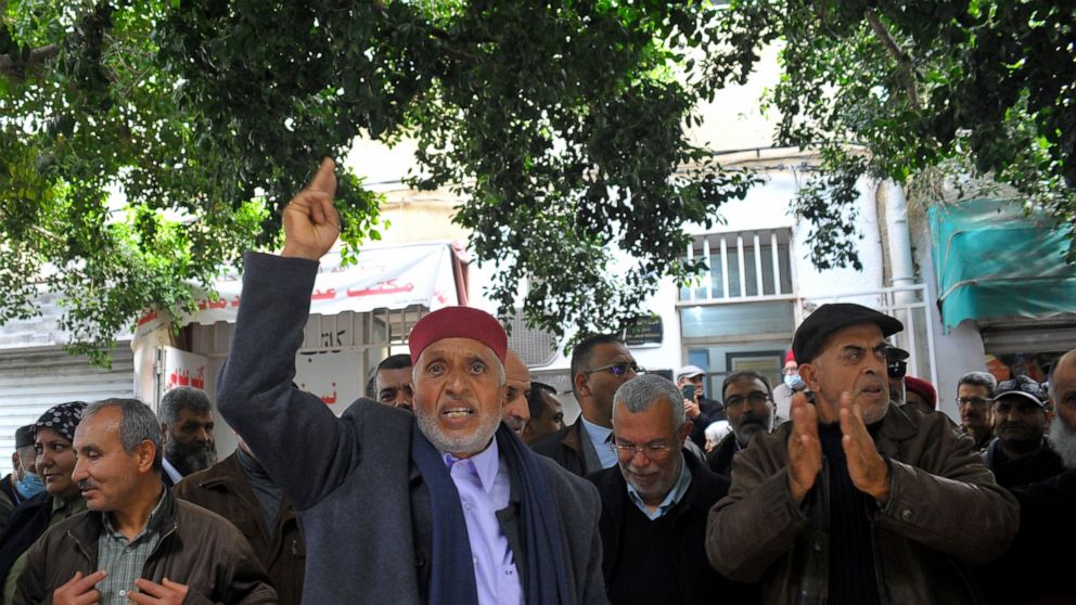 Supporters of the Tunisian Islamist movement Ennahda stage a protest in front of the justice ministry to denounce the arrest one of its senior leader in Tunis, Tunisia, Friday, Dec. 23, 2022. The protesters denounced the arrest of one of its senior l