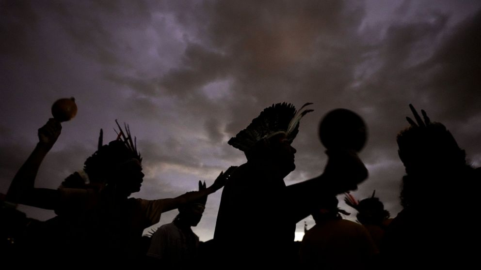 FILE - Indigenous people take part in a march during the 18th annual Free Land Indigenous Camp, in Brasilia, Brazil, Wednesday, April 13, 2022. Brazilian environmental and Indigenous organizations, together with some companies, are in a letter releas