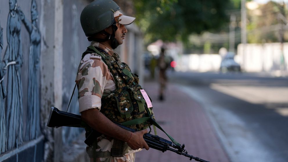 Paramilitary soldiers patrol a street in Jammu, India, Tuesday, Oct. 4, 2022. The prisons chief in Indian-controlled Kashmir has been killed, officials said Tuesday, as India’s powerful home minister arrived in the disputed Himalayan region on a thre