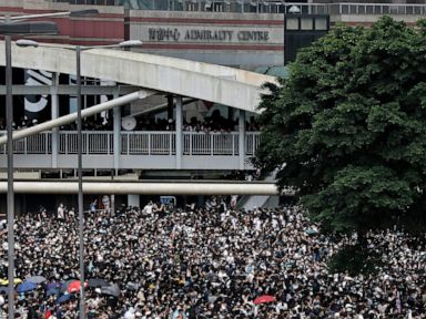 Hong Kong delays bill debate as protest crowds amass at HQ