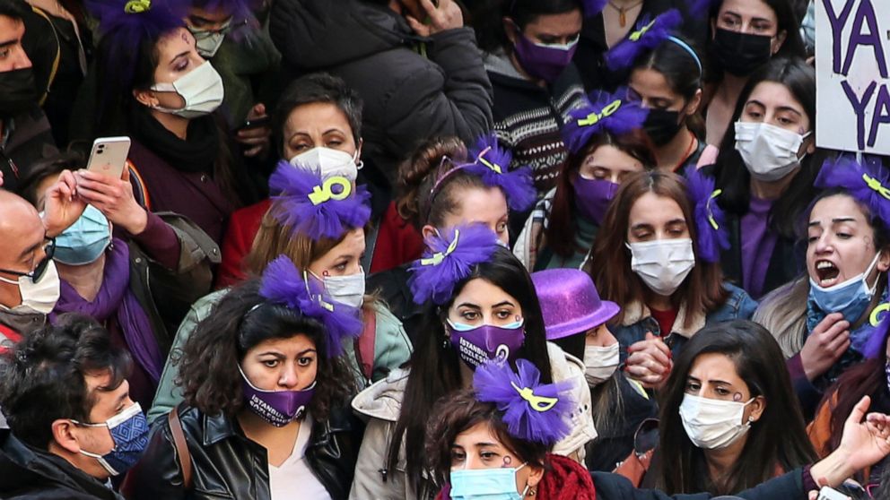FILE - In this March 8, 2021, photo, protesters chant slogans in front of police during a rally to mark the International Women's Day in Istanbul. Turkey's President Recep Tayyip Erdogan issued a decree early Saturday, March 20, 2021, annulling Turke