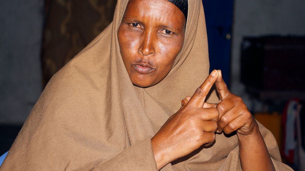 Fadumo Moalim Abdulle speaks, during an interview with the Associated Press in Mogadishu, Somalia, Monday, Jan, 18, 2021. The mother of eight has heard that her twenty year old son, Ahmed Ibrahim Jumaleh is one of the soldiers sent to Eritrea for mil