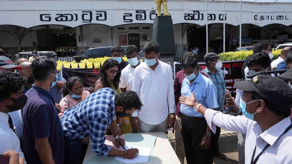 Sri Lankan civil rights activists place their signatures in a petition demanding the government repeal country's powerful Prevention of Terrorism Act in Colombo, Sri Lanka, Tuesday, Feb. 15, 2022. Protestors and critics warn the law is being used aga