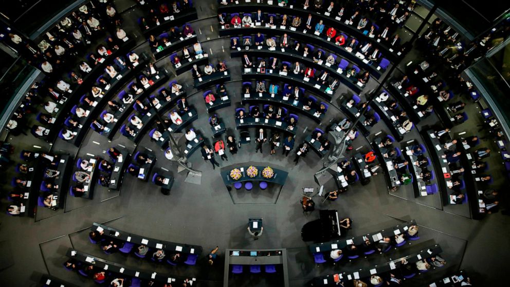 File - In this Thursday, Jan. 17, 2019 file photo German lawmakers attend a special parliament session at the Reichstag building, host of the German federal parliament, Bundestag, in Berlin, Germany, to celebrate 100 years of women's suffrage in Germ