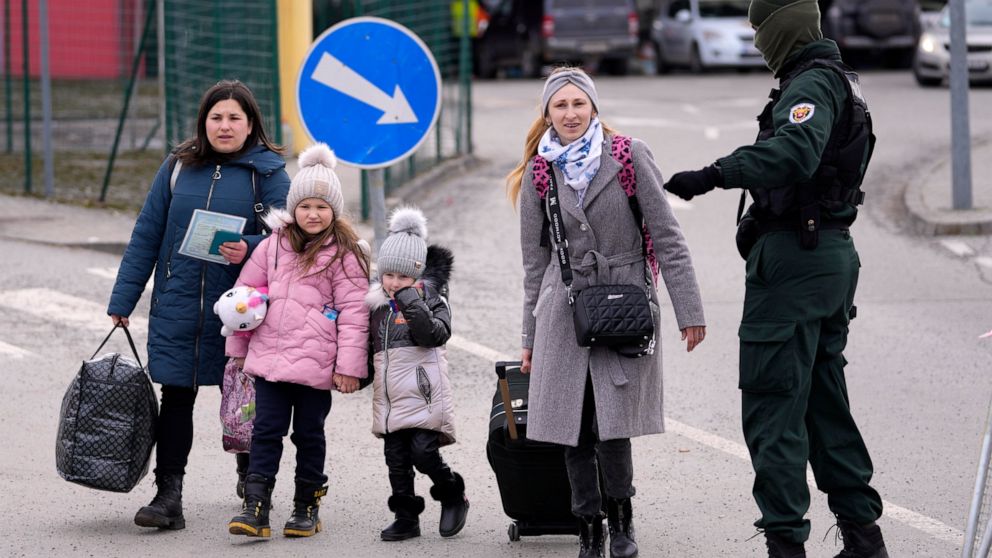 Refugees arrive from Ukraine at the border crossing Vysne Nemecke, Slovakia, Tuesday, March 1, 2022. (AP Photo/Darko Vojinovic)