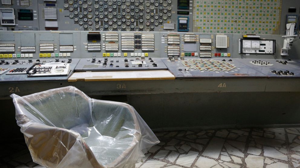 FILE - An operator's arm-chair covered with plastic sits in an empty control room of the 3rd reactor at the Chernobyl nuclear plant, in Chernobyl, Ukraine, on April 20, 2018. Russia’s attack on a nuclear power plant in Ukraine has revived the fears o