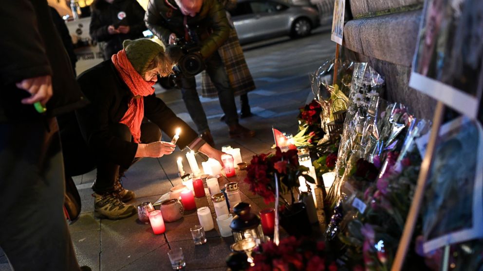Flowers and candles are placed in memory of two Scandinavian university students who were killed in a remote area of the Atlas Mountains in Morocco, at the Town Hall Square in Copenhagen, Friday Dec. 28, 2018. Norwegian Maren Ueland and Dane Louisa V