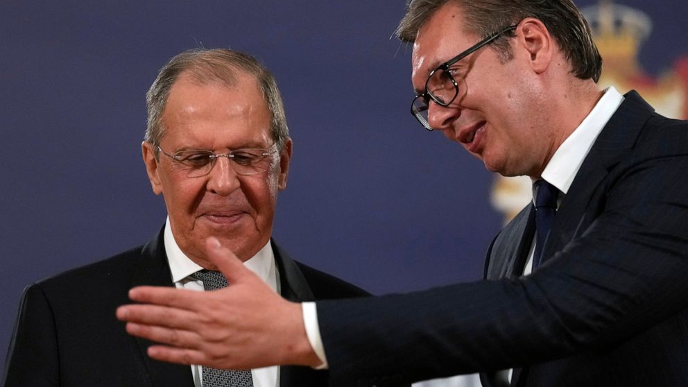 FILE - Russian Foreign Minister Sergey Lavrov, left, speaks with Serbia's President Aleksandar Vucic after a press conference in Belgrade, Serbia, Sunday, Oct. 10, 2021. European Union candidate Serbia has signed an agreement with Russia to hold mutu