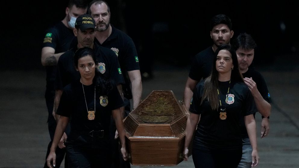 Federal police officers arrive with recovered human remains believed to be of the Indigenous expert Bruno Pereira of Brazil and freelance reporter Dom Phillips of Britain, at the Federal Police hangar in Brasília, Brazil, Thursday,, June 16, 2022. A 