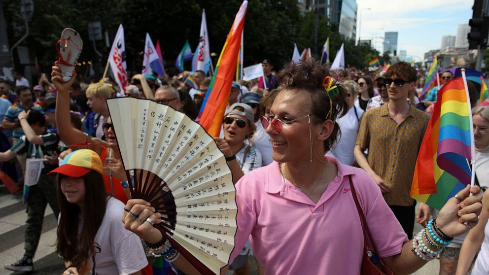 People take part in the 'Warsaw and Kyiv Pride' marching for freedom in Warsaw, Poland, Saturday, June 25, 2022. Due to Russia's full-scale war against Ukraine the 10th anniversary of the equality march in Kyiv can't take place in the usual format in