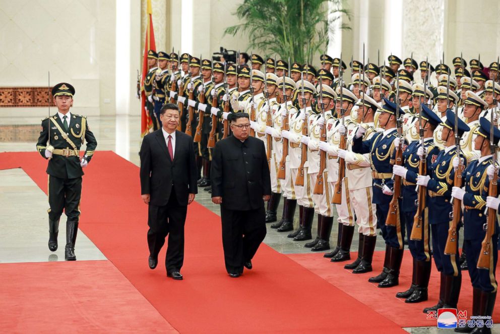 PHOTO: North Korean leader Kim Jong Un, right, walks beside Chinese President Xi Jinping in Beijing, in this undated photo released June 20, 2018 by North Korea's Korean Central News Agency.