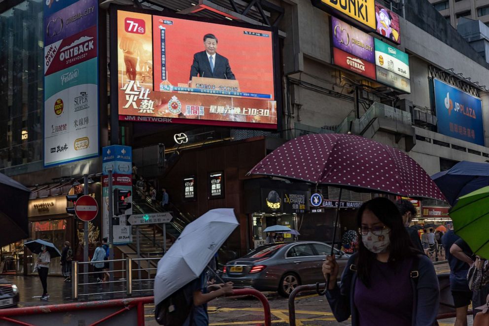 PHOTO: HONG KONG, CHINA - JUNE 30: Chinese President Xi Jinping speaks during a news conference, displayed on a television screen at a shopping area on June 30, 2022 in Hong Kong, China.