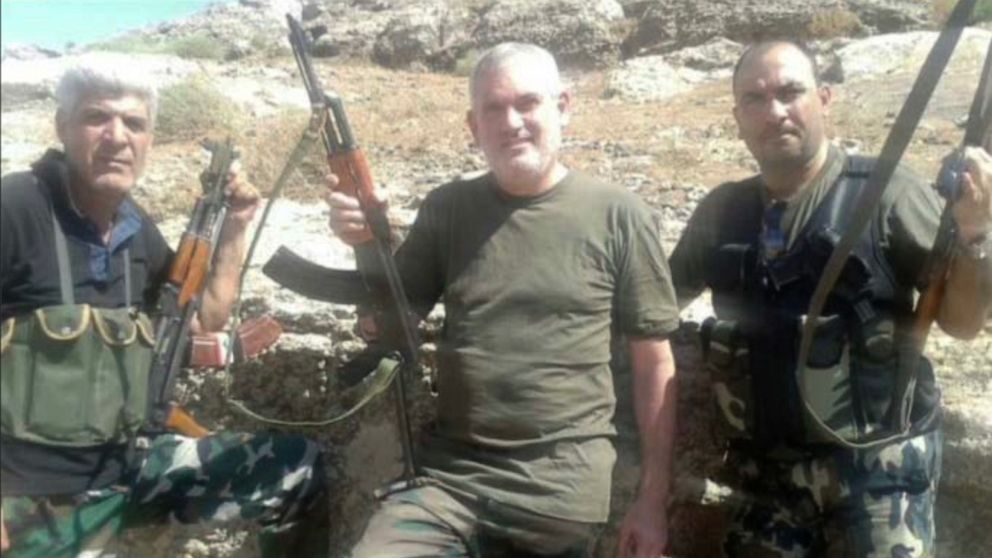 PHOTO: Adel El Zabayar is seen in a photo, which was included in court documents, with two men in Syria holding weapons. The photo is believed to have been taken in or around August 2013 before it was released to the media.