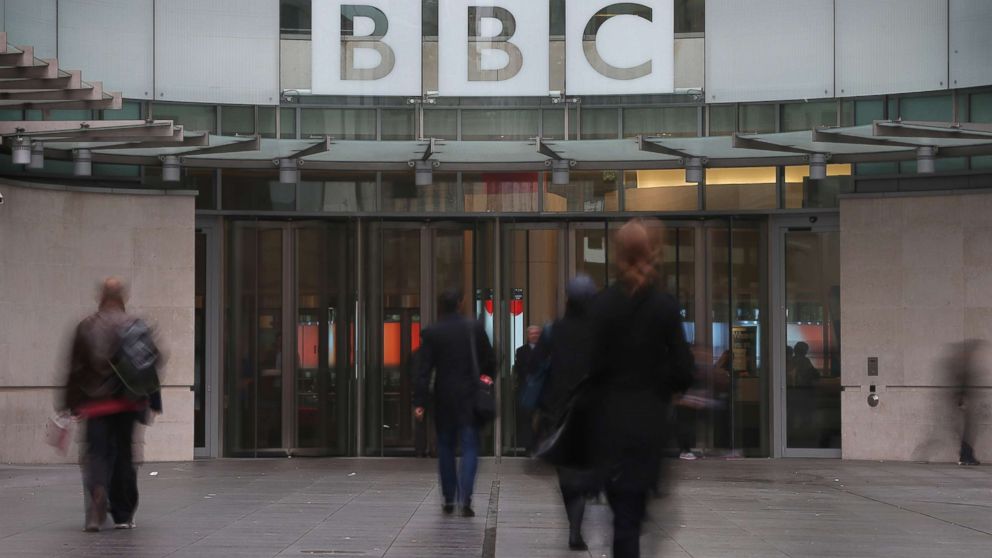 People walk near the entrance to BBC Broadcasting House on Oct. 22, 2012, in London.