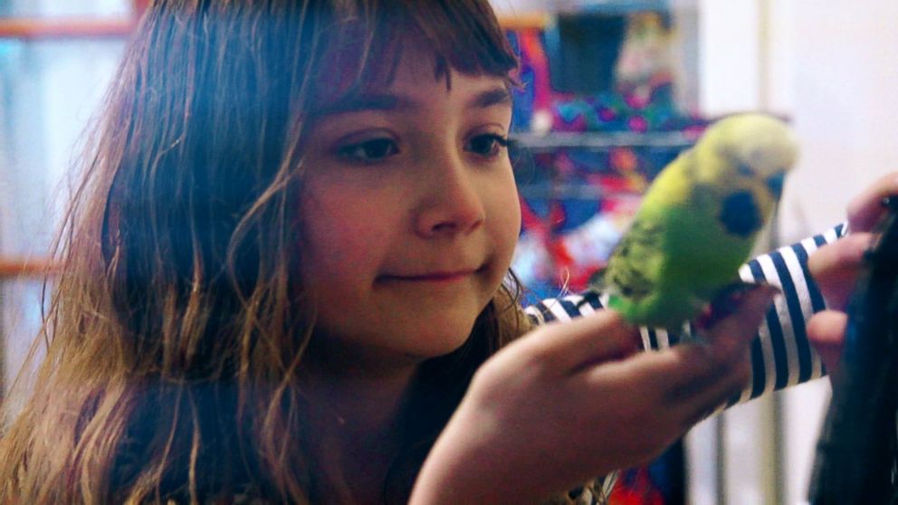 PHOTO: Aelita Andre pictured with Greengrass, one of her pet birds.