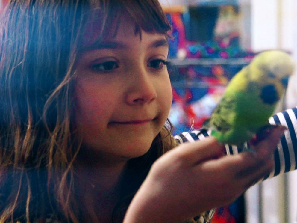 PHOTO: Aelita Andre pictured with Greengrass, one of her pet birds.