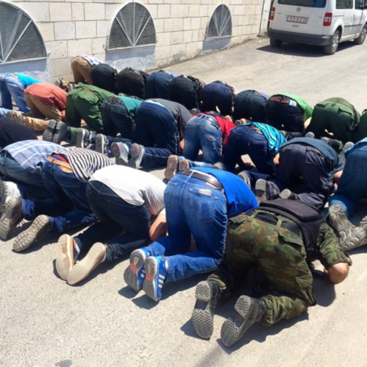 PHOTO: Men praying at Duma’s main mosque ahead of Ali Dawabsheh’s funeral.