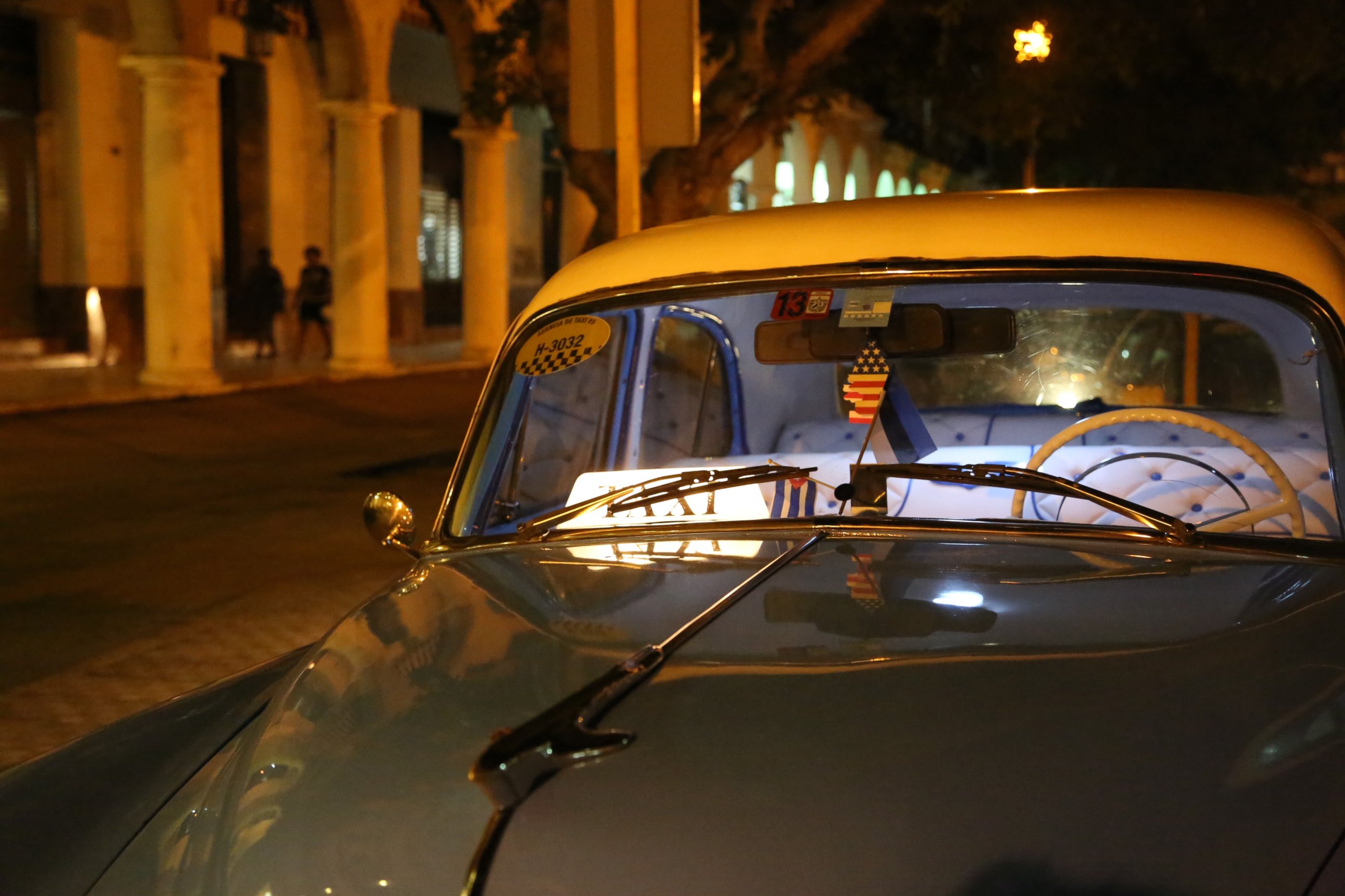 PHOTO: A Cuban taxi sits empty with an American flag air freshener inside on August 12, 2015. 