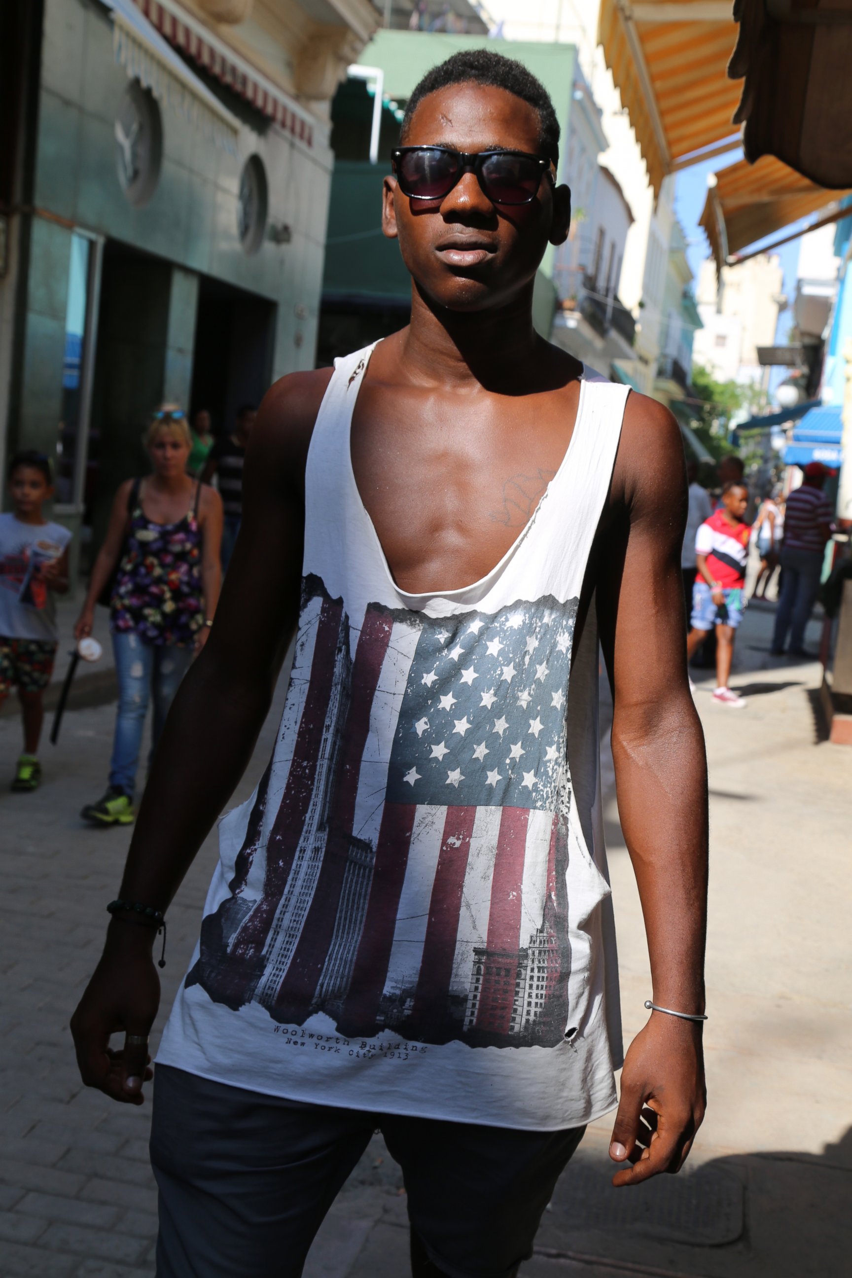 PHOTO: 21-year-old Alexis Vidal Sobori stands on a street in Cuba wearing his American flag sleeveless shirt on August 12, 2015. 