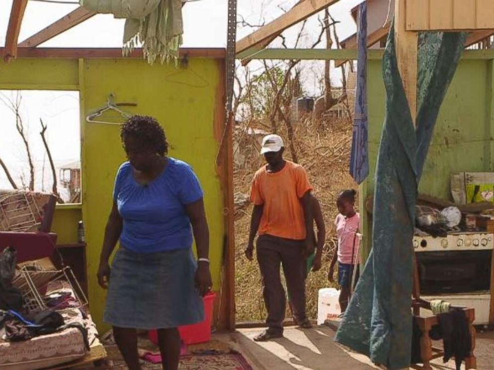 Verlyn Peter picked her way through the wreckage of her home in Dominica after Hurricane Maria.