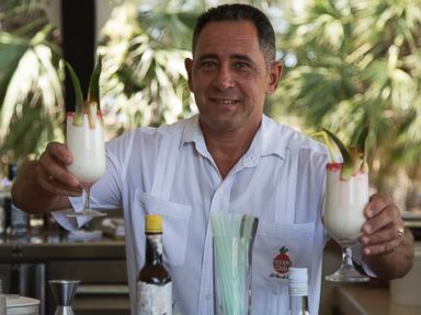 PHOTO: Juan Miguel, Elians father, serves up Pina Coladas at his job as a bartender - the same job he had before the US/Cuba custody battle.