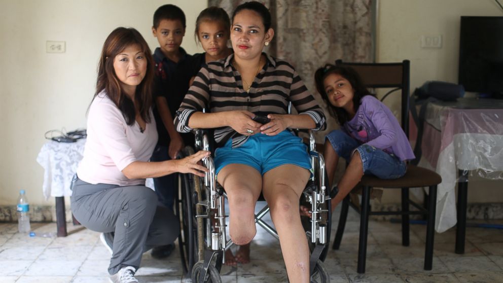 "I remembered he had a machete under the bed. That's when the attack began," said Heydi, 30, San Pedro Sula, Honduras, with ABC's Juju Chang beside her.