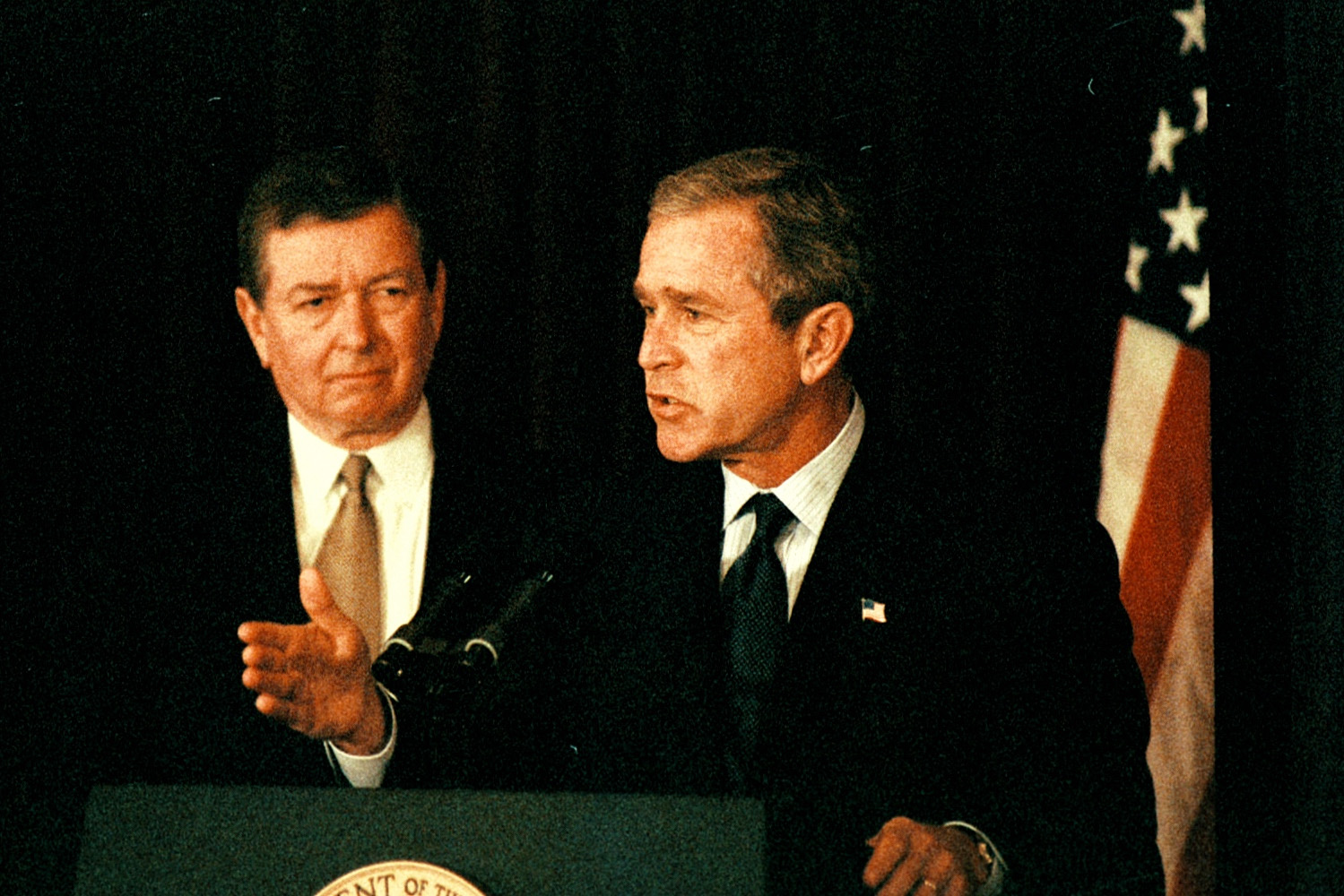 PHOTO: Flanked by then-U.S. Attorney General John Ashcroft, President George W. Bush announces the FBI's first Most Wanted Terrorist list at FBI headquarters on Oct. 10, 2001.