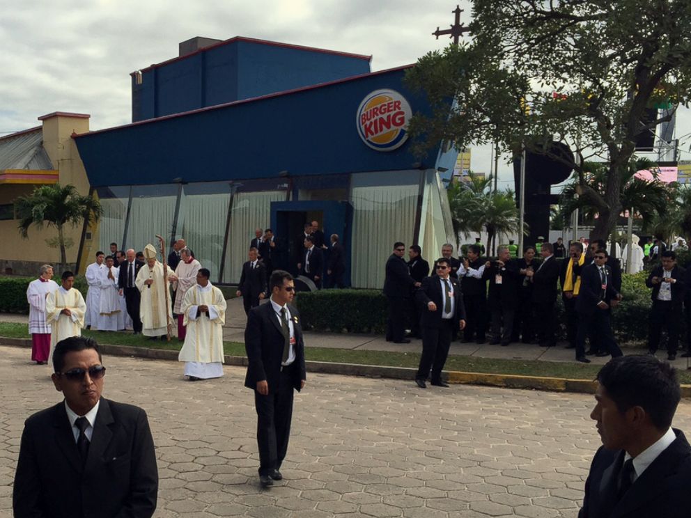 PHOTO: Pope Francis stands outside the Burger King franchise that served as a makeshift sacristy for open air mass in Santa Cruz, Bolivia, July 9, 2015.