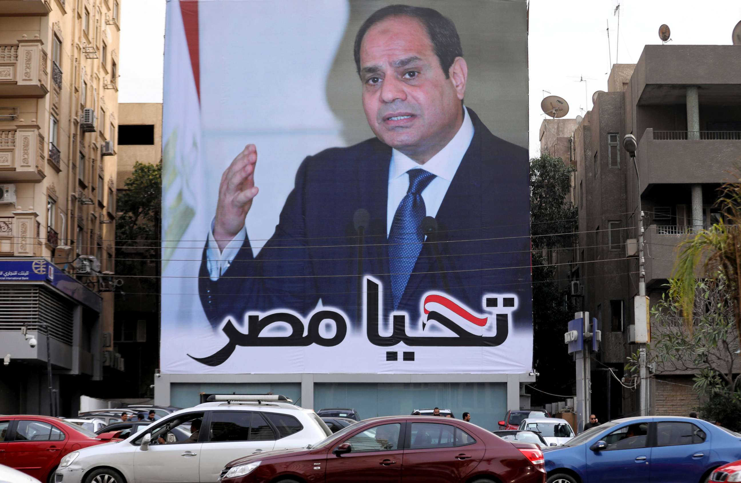 PHOTO: Cars pass by a poster of Egypt's President Abdel Fattah al-Sisi for the upcoming presidential election, in Cairo, Egypt, Feb. 19, 2018. The writing on the poster reads: "Long live Egypt."
