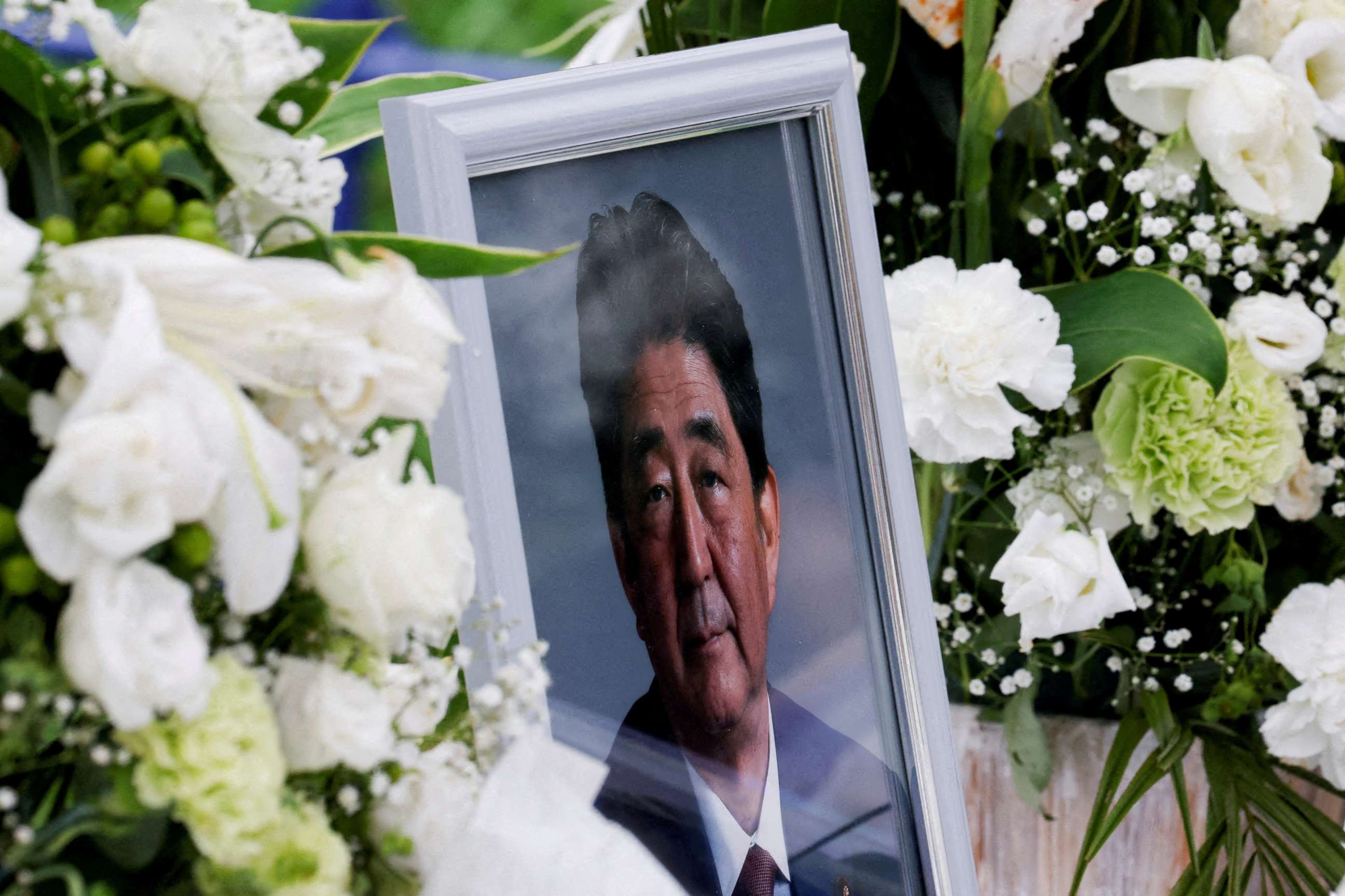 FILE PHOTO: A picture of late former Japanese Prime Minister Shinzo Abe is seen in Tokyo, Japan, on July 12, 2022.