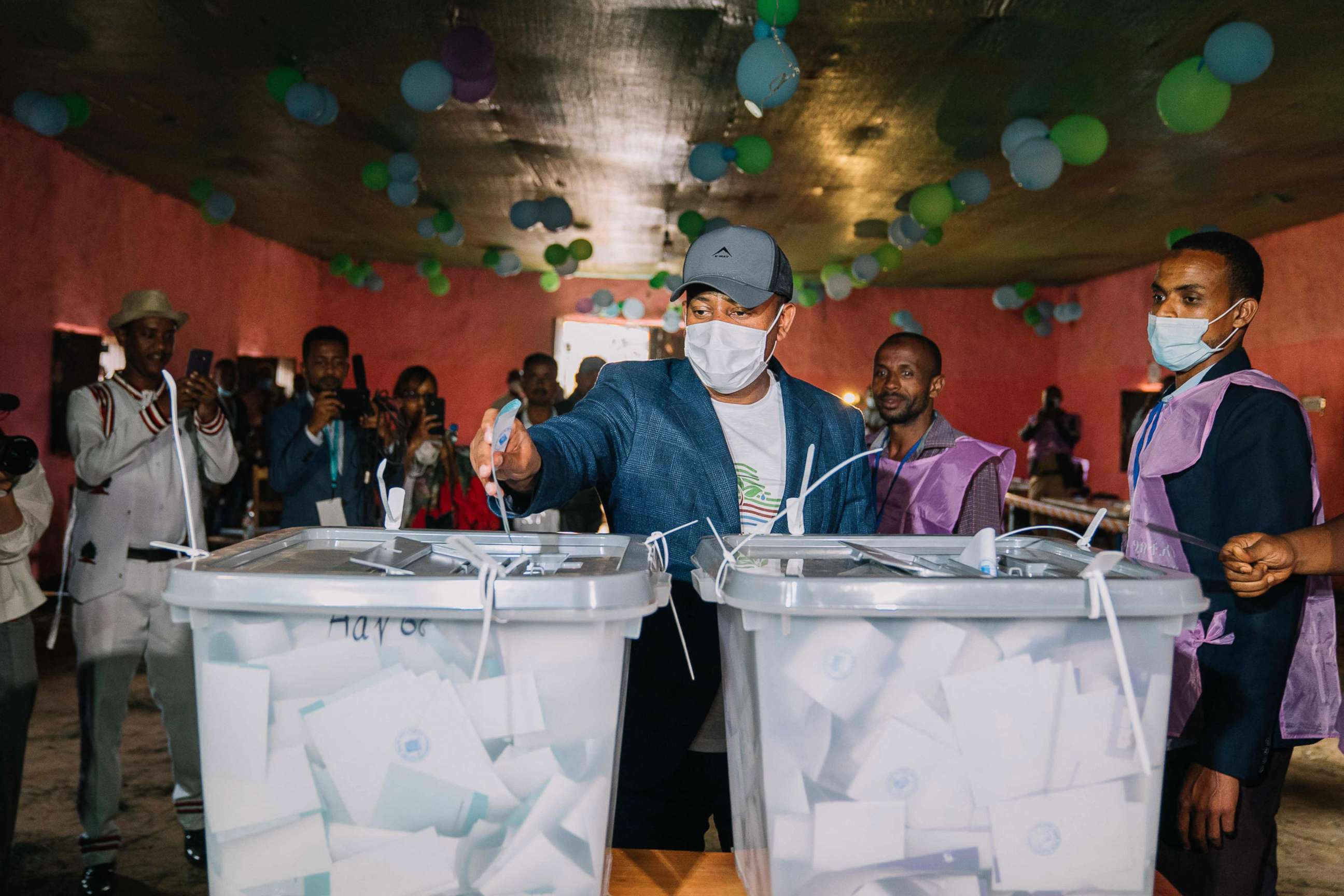 PHOTO: This handout picture taken and released by the Ethiopia Prime Minister Office in Beshasha, Ethiopia on June 21, 2021, shows Ethiopian Prime Minister Abiy Ahmed casting his ballot at a polling station.