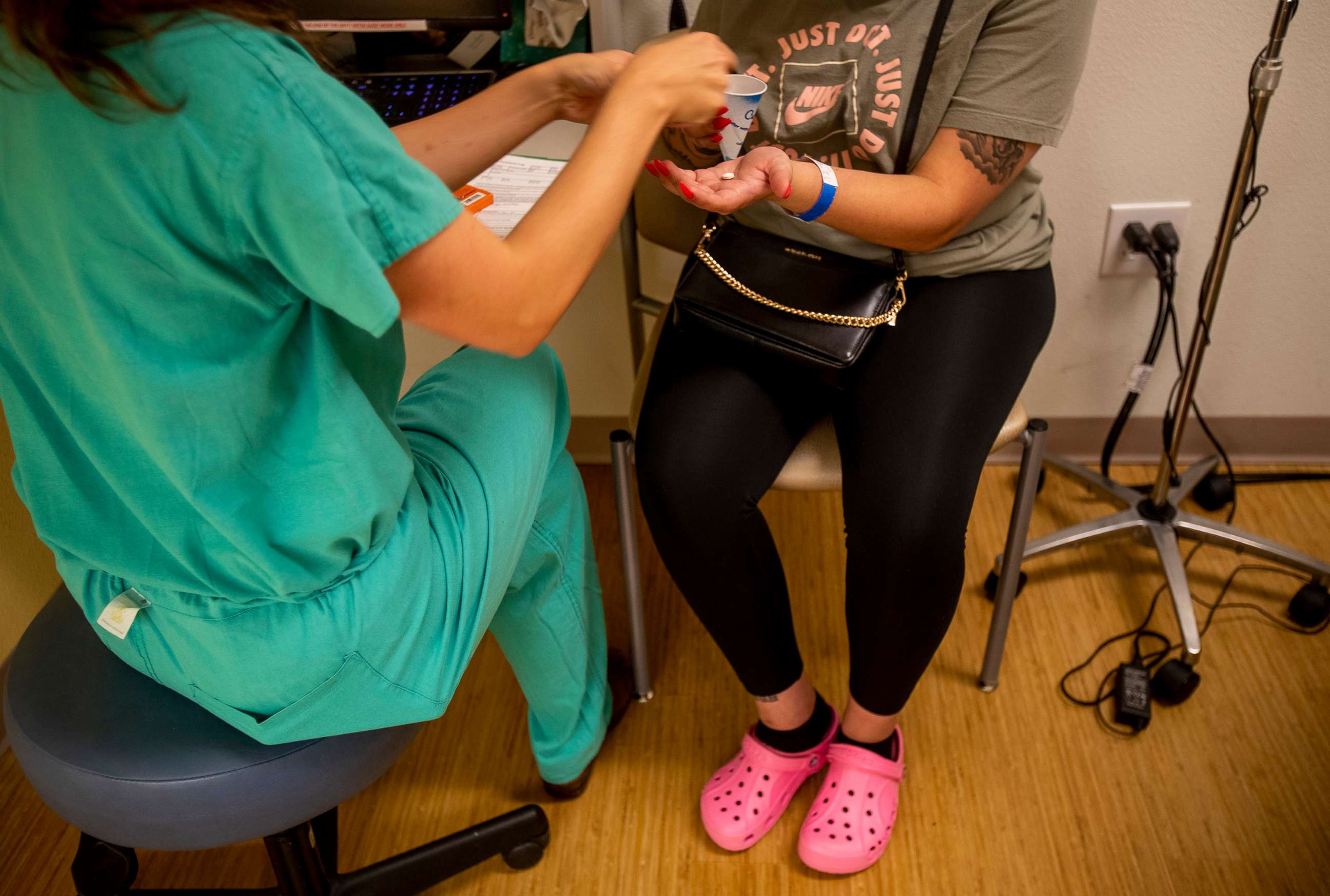 PHOTO: A resident gives a 25-year-old woman medication to terminate her pregnancy  the day before the Supreme Court overturned Roe v. Wade at the Center for Reproductive Health clinic on in Albuquerque, N.M., June 23, 2022.