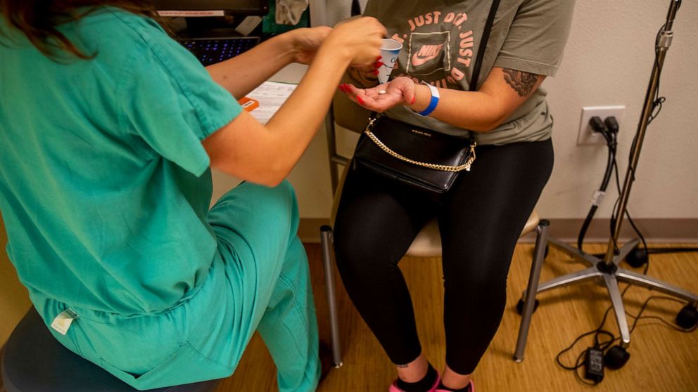 PHOTO: A resident gives a 25-year-old woman medication to terminate her pregnancy  the day before the Supreme Court overturned Roe v. Wade at the Center for Reproductive Health clinic on in Albuquerque, N.M., June 23, 2022.