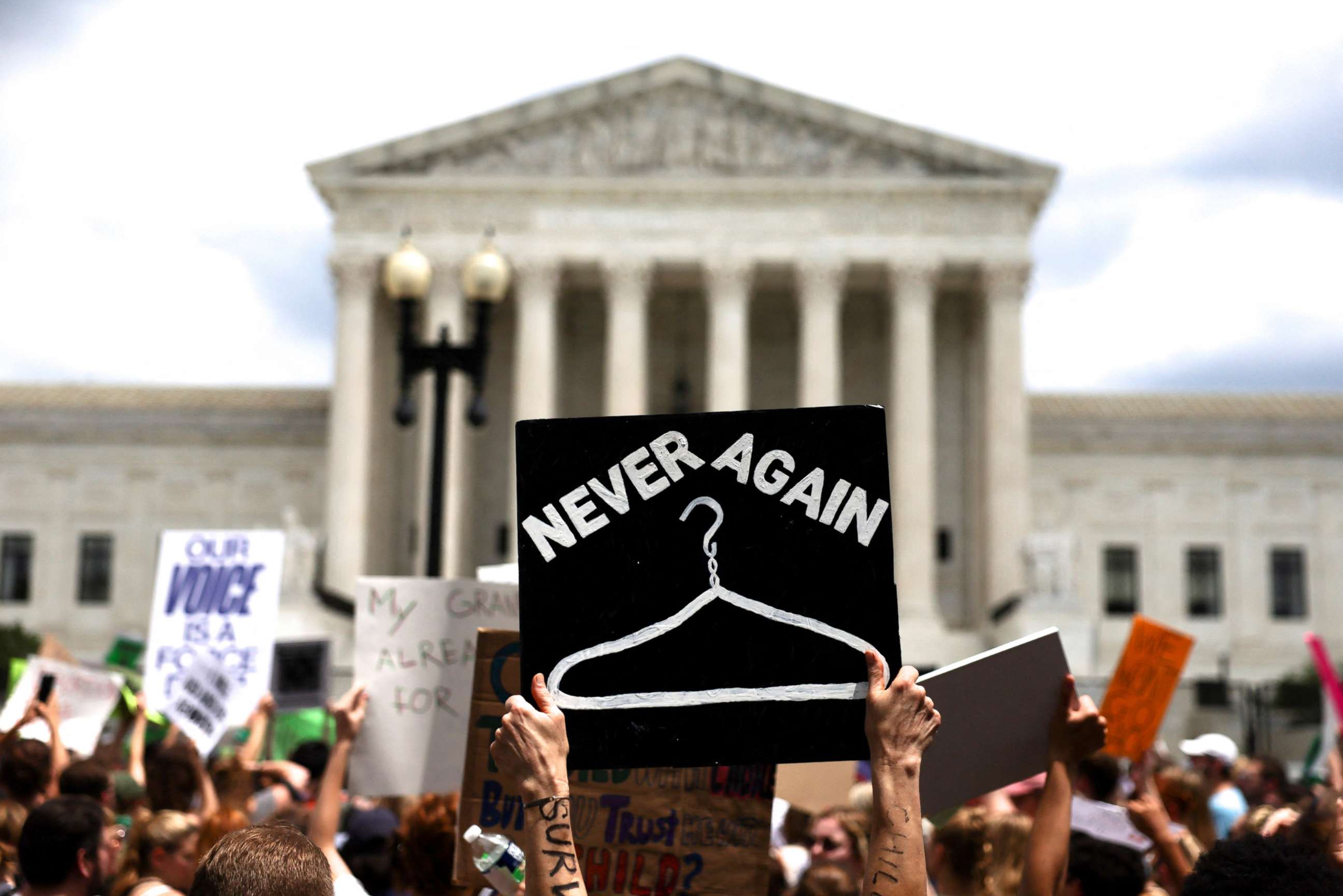 PHOTO: Abortion rights supporters protest outside the U.S. Supreme Court as the court issued its ruling in the Dobbs v Women's Health Organization abortion case, overturning the landmark Roe v Wade abortion decision in Washington, June 24, 2022.