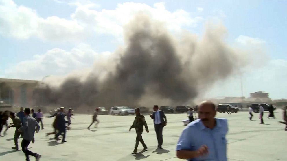 PHOTO: People running after the explosion that rocked Aden's airport, in Aden, Yemen, Dec. 30, 2020.
