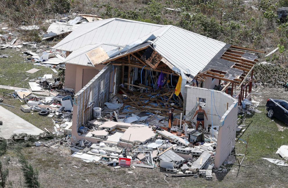 PHOTO: Residents look through the remains of a home after hurricane Dorian hit the Grand Bahama Island in the Bahamas, Sept. 4, 2019.