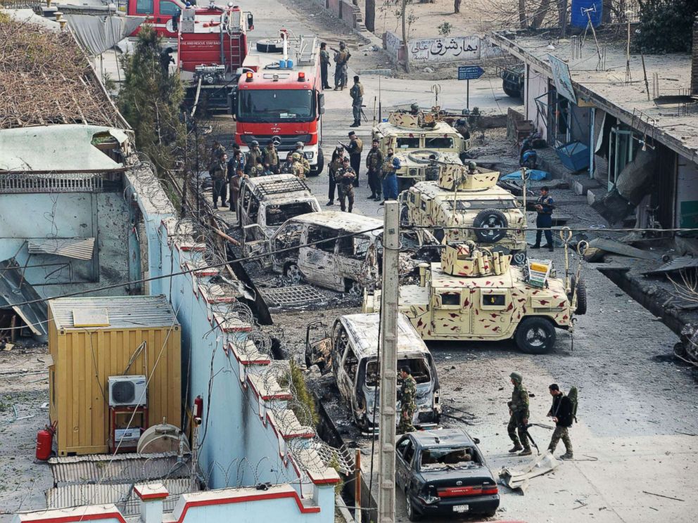 PHOTO: Afghan security personnel gather near an office near the British charity Save the Children after an attack in Jalalabad, Jan. 24, 2018.