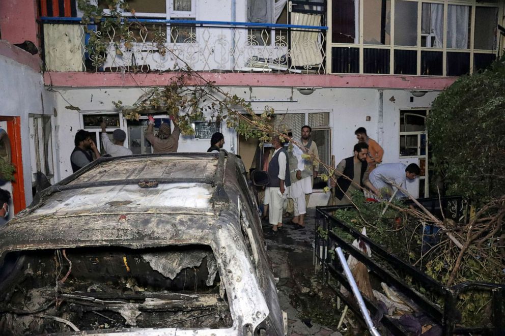 PHOTO: In this Sunday, Aug. 29, 2021 file photo, Afghans inspect damage of the Ahmadi family house after a U.S. drone strike in Kabul, Afghanistan. The Pentagon retreated from its defense of a strike that killed multiple civilians last month.