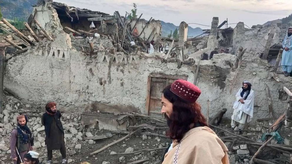 PHOTO: In this photo released by a state-run news agency Bakhtar, Afghans look at destruction caused by an earthquake in the province of Paktika, eastern Afghanistan, June 22, 2022.