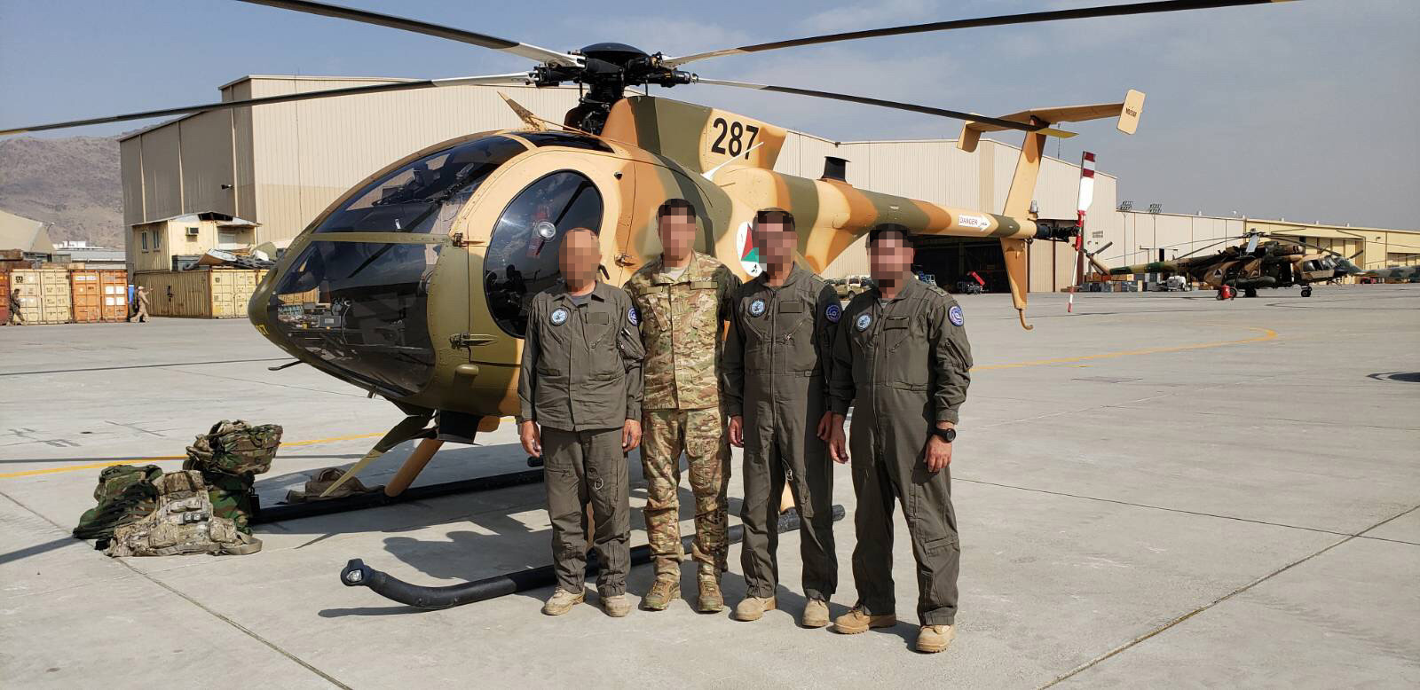 PHOTO: A group of Afghan pilots from two squadrons that flew MD530F helicopters are pictured together at an undisclosed location.