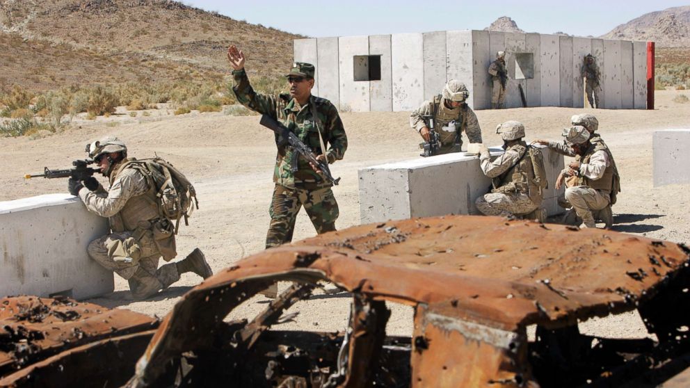 PHOTO: An Afghan soldier, second from left, and U.S. Marines respond to an explosion inside a mock Afghan village during a training exercise Tuesday, Sept. 23, 2008,  in Twentynine Palms, Calif. 